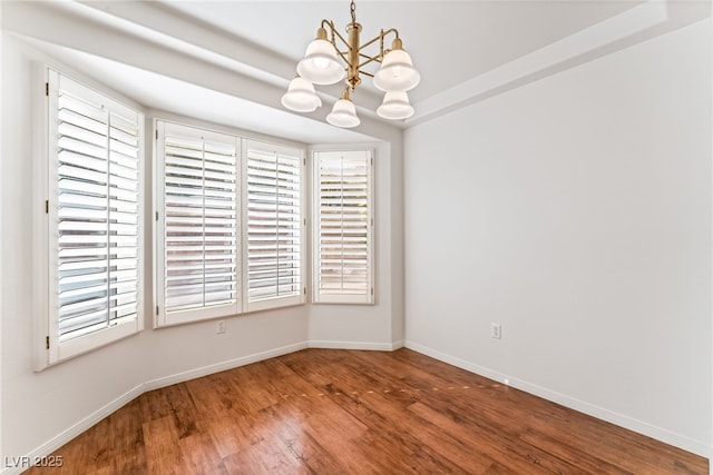 10029 Netherton Dr, Las Vegas, NV 89134 - unfurnished dining area featuring baseboards, wood finished floors, and a notable chandelier