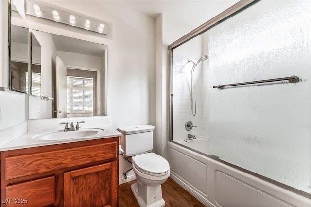 10029 Netherton Dr, Las Vegas, NV 89134 - full bath with vanity, enclosed tub / shower combo, wood finished floors, and toilet
