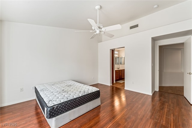10029 Netherton Dr, Las Vegas, NV 89134 - bedroom featuring visible vents, wood finished floors, baseboards, connected bathroom, and a ceiling fan