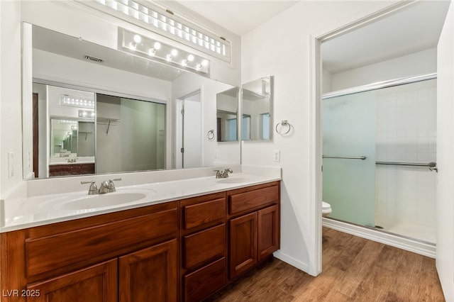 10029 Netherton Dr, Las Vegas, NV 89134 - full bath featuring a sink, a stall shower, toilet, and visible vents
