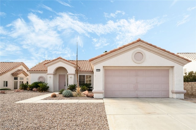 10029 Netherton Dr, Las Vegas, NV 89134 - mediterranean / spanish-style home with an attached garage, stucco siding, concrete driveway, and a tile roof