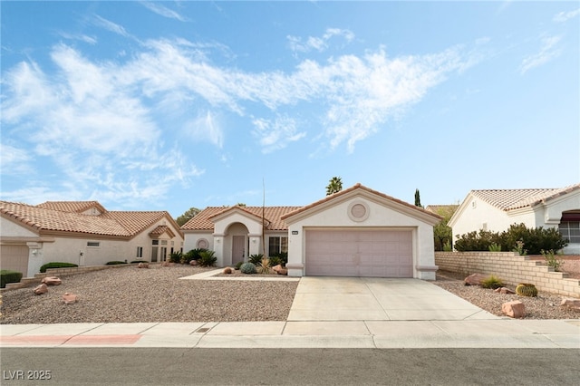 10029 Netherton Dr, Las Vegas, NV 89134 - mediterranean / spanish home with an attached garage, stucco siding, and concrete driveway