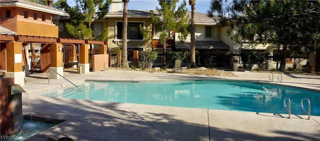 community pool featuring a patio area