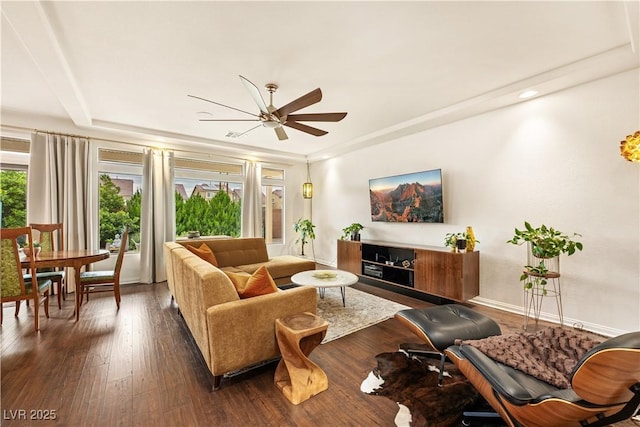 living area featuring baseboards, ceiling fan, and wood finished floors