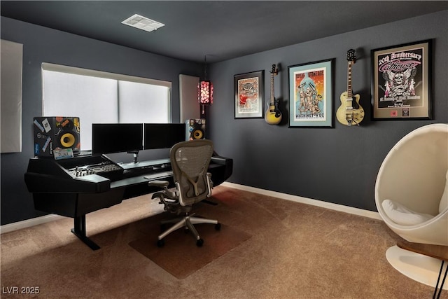 carpeted office with baseboards and visible vents