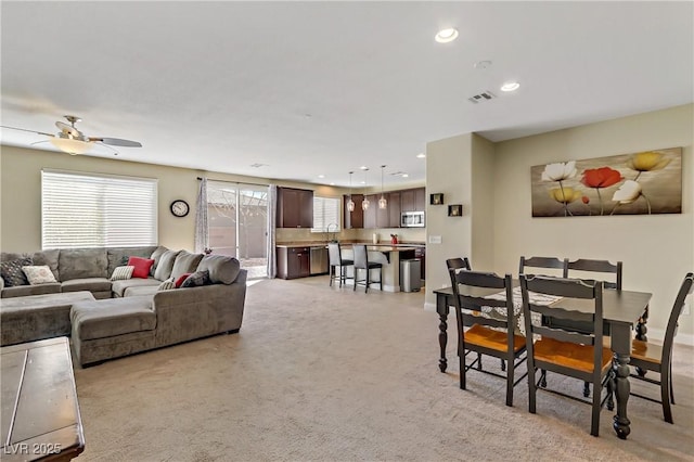 dining room featuring ceiling fan, recessed lighting, visible vents, and light colored carpet
