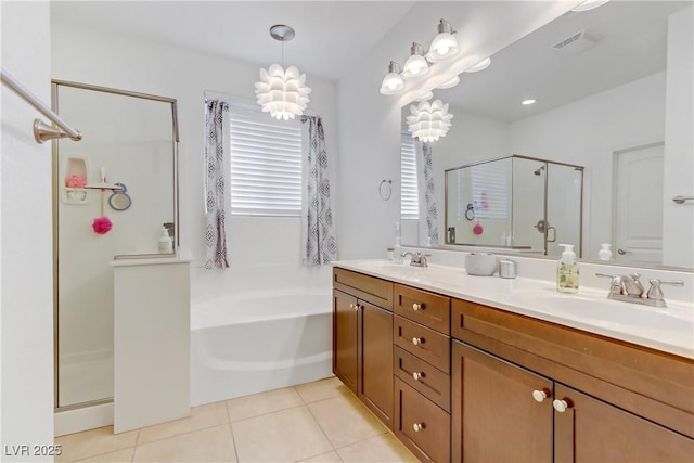 bathroom featuring a sink, tile patterned floors, a shower stall, visible vents, and a garden tub