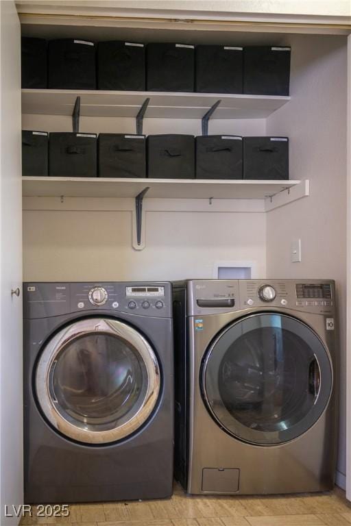 laundry area with separate washer and dryer and laundry area