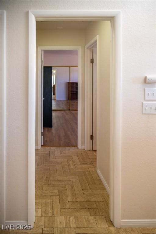 corridor featuring baseboards