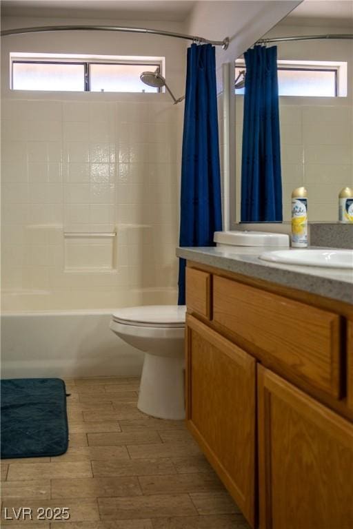 full bath with shower / bath combo, a wealth of natural light, and toilet
