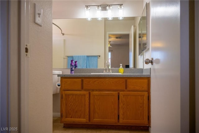 bathroom featuring vanity, ceiling fan, and tile patterned floors