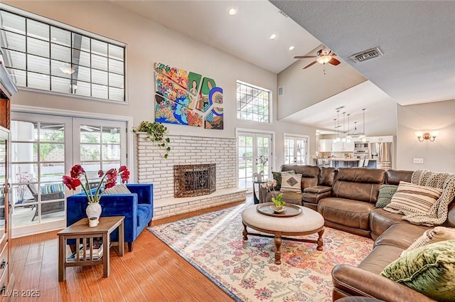 3151 Coachlight Cir, Las Vegas, NV 89117 - living room with high vaulted ceiling, visible vents, and french doors