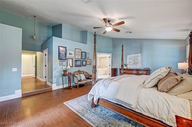 3151 Coachlight Cir, Las Vegas, NV 89117 - bedroom featuring visible vents, wood finished floors, baseboards, a ceiling fan, and vaulted ceiling