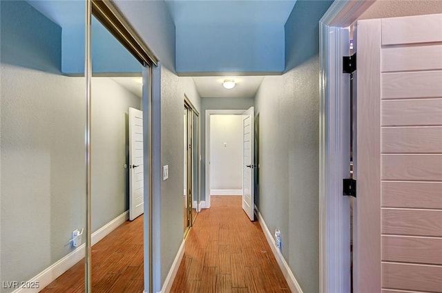 3151 Coachlight Cir, Las Vegas, NV 89117 - corridor featuring baseboards and wood finished floors