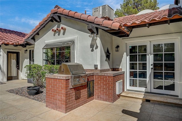 3151 Coachlight Cir, Las Vegas, NV 89117 - view of patio with grilling area, exterior kitchen, and french doors