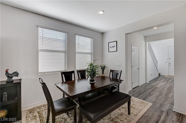 dining area with baseboards, recessed lighting, and wood finished floors