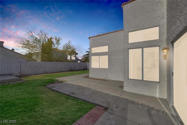 exterior space with a patio and a fenced backyard