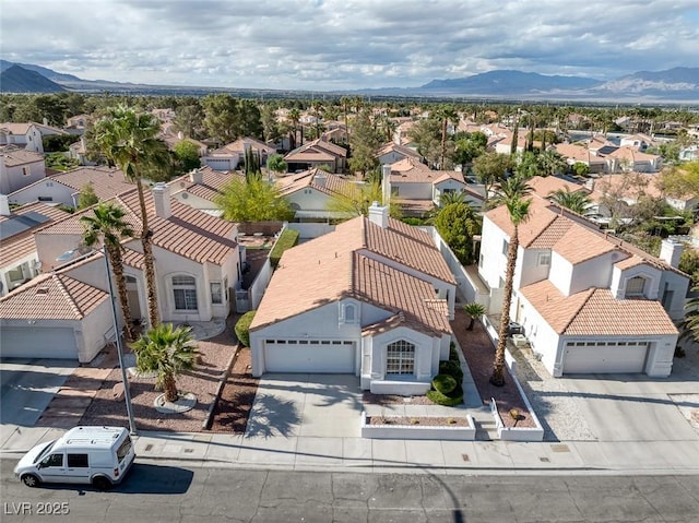 drone / aerial view with a residential view and a mountain view