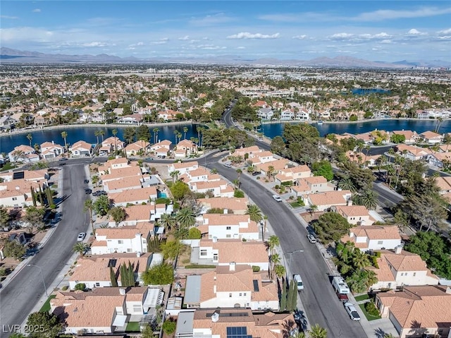 aerial view with a residential view and a water and mountain view