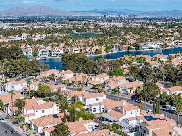 birds eye view of property with a residential view and a water and mountain view