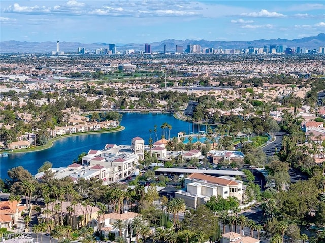 birds eye view of property featuring a water and mountain view and a view of city