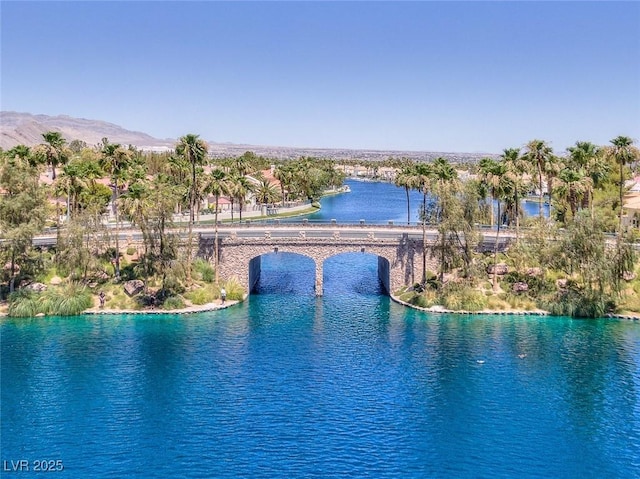 view of pool with a water view