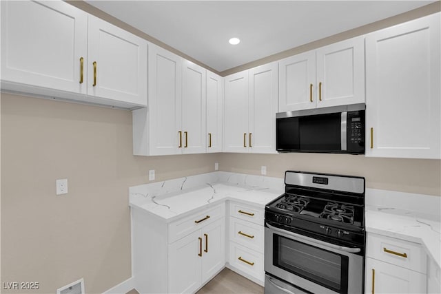 2007 Cutlass Dr Unit 0, Henderson, NV 89014 - kitchen with visible vents, light stone countertops, recessed lighting, white cabinets, and appliances with stainless steel finishes