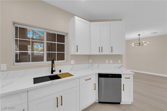 2007 Cutlass Dr Unit 0, Henderson, NV 89014 - kitchen with light stone countertops, dishwasher, a sink, white cabinets, and a chandelier