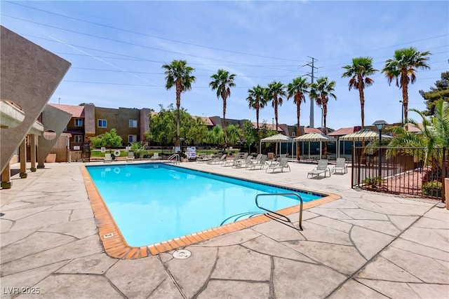 pool featuring a patio and fence