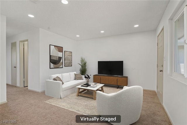 living room featuring carpet flooring, recessed lighting, and baseboards