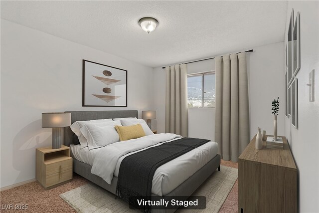 bedroom featuring light colored carpet and a textured ceiling