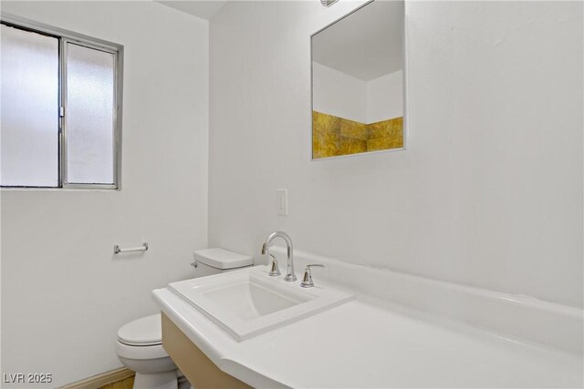 bathroom with a sink and toilet
