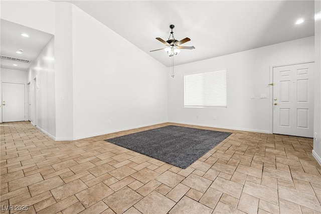 foyer entrance featuring a ceiling fan, baseboards, recessed lighting, lofted ceiling, and visible vents