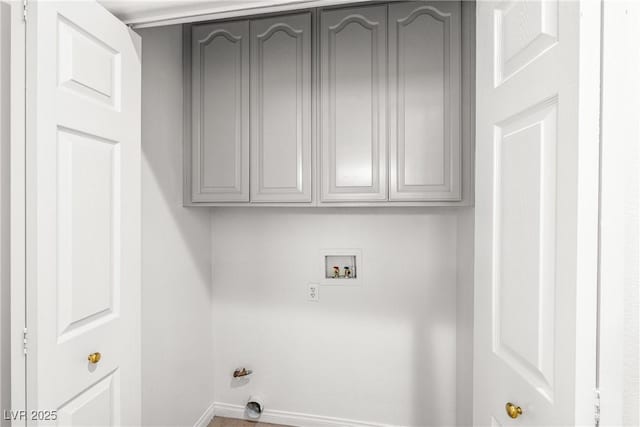 laundry room featuring cabinet space, baseboards, hookup for a gas dryer, and hookup for a washing machine