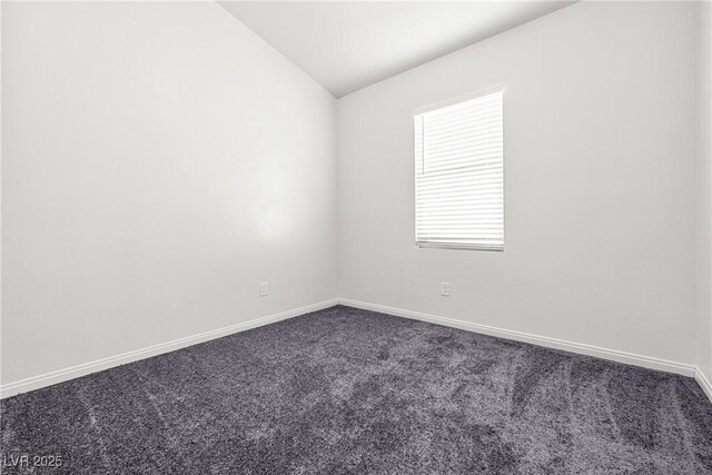 1440 Summer Glow Ave, Henderson, NV 89012 - empty room with baseboards, vaulted ceiling, and dark colored carpet