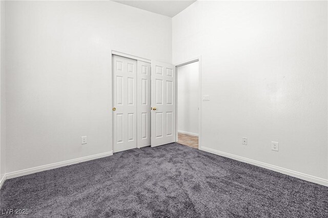 1440 Summer Glow Ave, Henderson, NV 89012 - unfurnished bedroom featuring baseboards, carpet flooring, and a closet