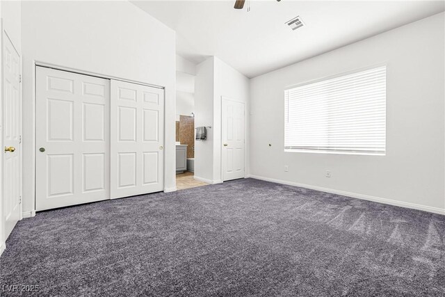1440 Summer Glow Ave, Henderson, NV 89012 - unfurnished bedroom featuring ceiling fan, visible vents, vaulted ceiling, carpet floors, and baseboards