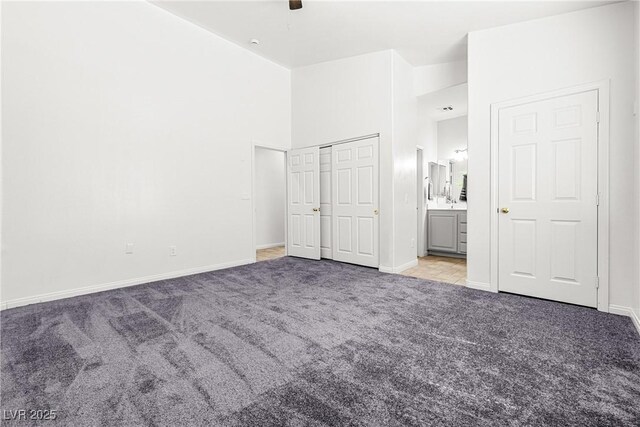 1440 Summer Glow Ave, Henderson, NV 89012 - unfurnished bedroom with baseboards, a ceiling fan, carpet, and ensuite bath