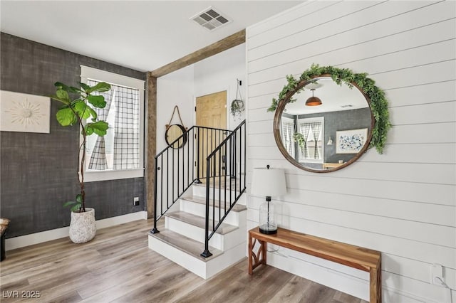 7566 Hope Valley St, Las Vegas, NV 89139 - staircase featuring visible vents, baseboards, wood finished floors, and a wealth of natural light
