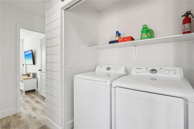 7566 Hope Valley St, Las Vegas, NV 89139 - laundry area featuring light wood-style floors, baseboards, laundry area, and independent washer and dryer