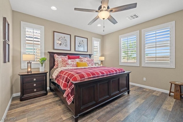 bedroom with recessed lighting, baseboards, visible vents, and wood finished floors