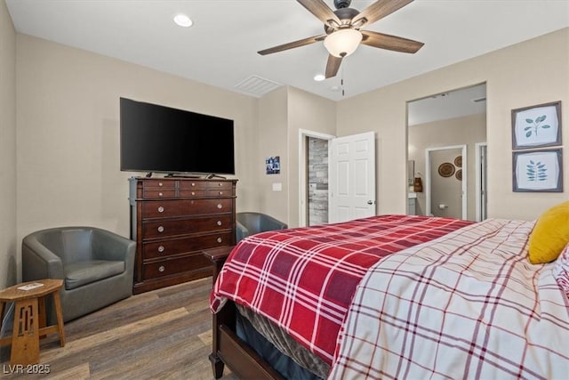 bedroom with recessed lighting, ceiling fan, wood finished floors, and visible vents