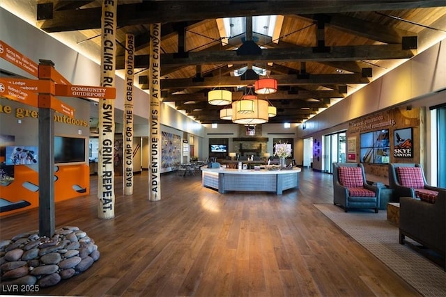 living room with wood-type flooring, wood ceiling, beam ceiling, and high vaulted ceiling