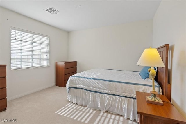 bedroom with baseboards, carpet, and visible vents