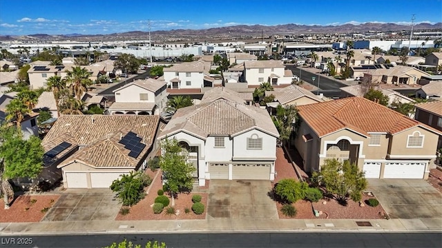 birds eye view of property with a residential view and a mountain view