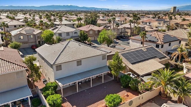 drone / aerial view with a residential view and a mountain view