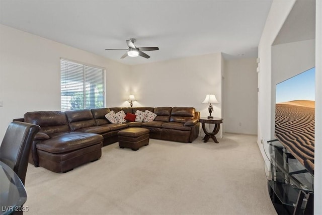carpeted living room featuring ceiling fan