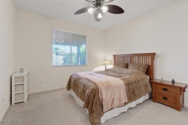 bedroom with baseboards, light carpet, and a ceiling fan