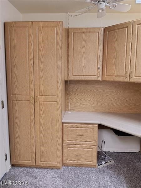 unfurnished office with light carpet and a ceiling fan