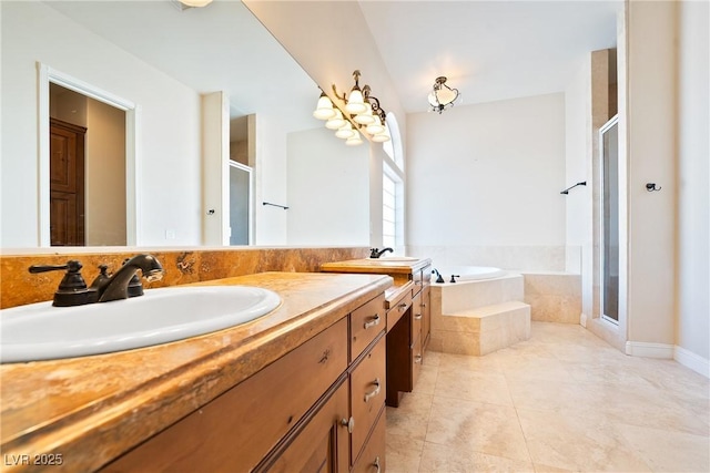 bathroom with vanity, tile patterned floors, a bath, and a stall shower
